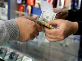 Hands exchanging currency.