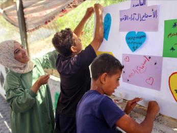 Palestine community members participate in a youth program.