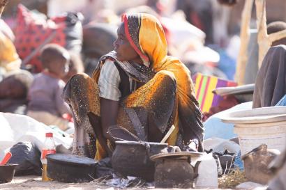 Families displaced by violence live in makeshift shelters in Tawila, Sudan, near El Fasher, where conflict has worsened famine conditions as of April 2025.
