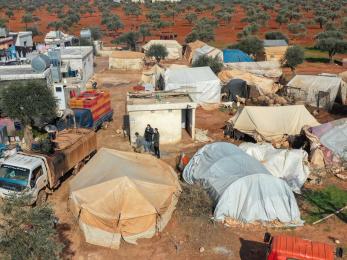 In northwest syria, mercy corps teams provide water and hygiene support to an encampment for people forced from their homes by violence.