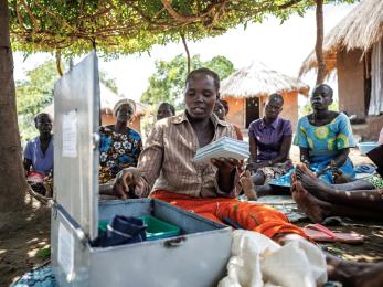 Members of a savings group meet to review goals.