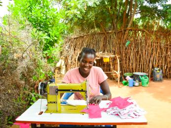 A person working on their sewing machine.
